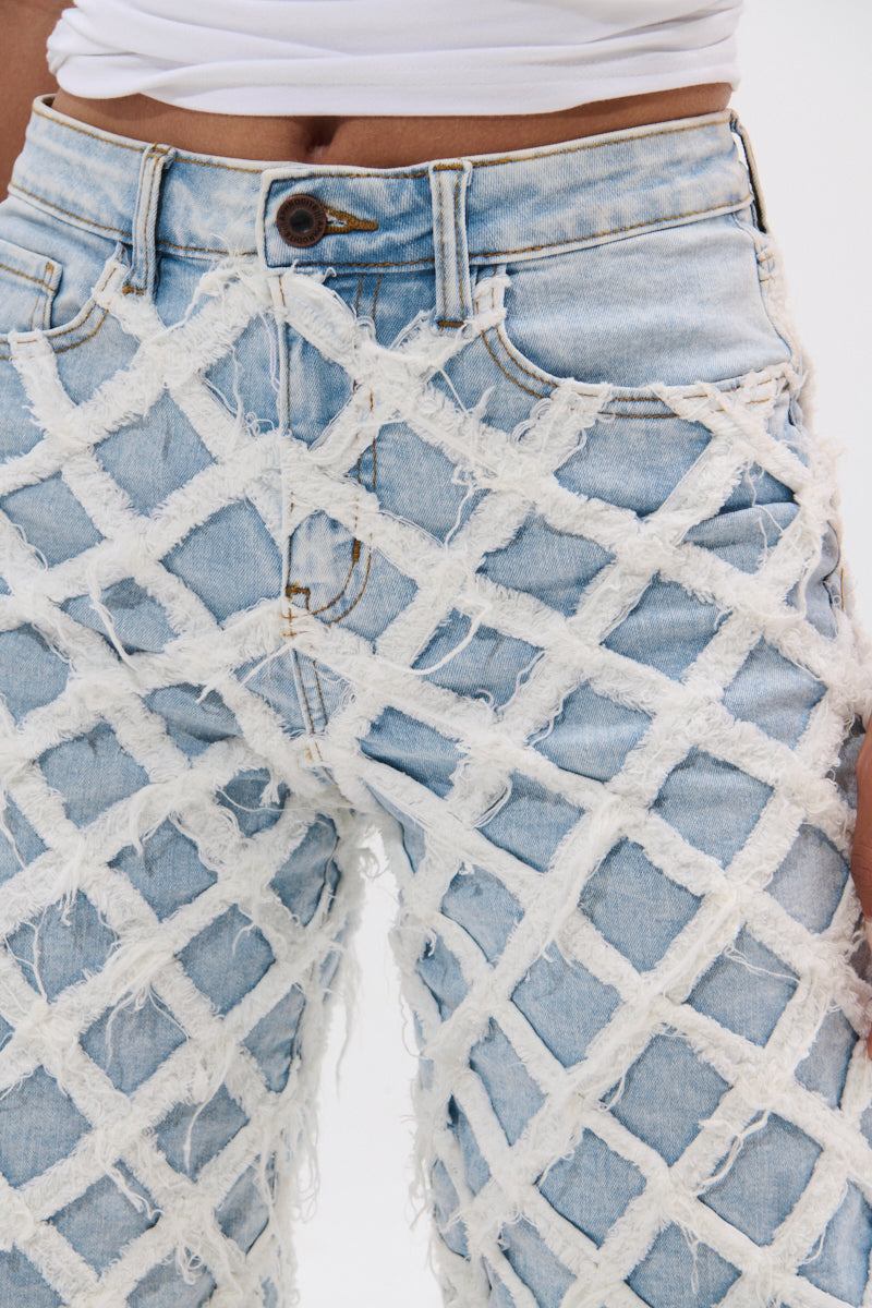 DISTRESSED AND STRESSED DENIM BERMUDA SHORT